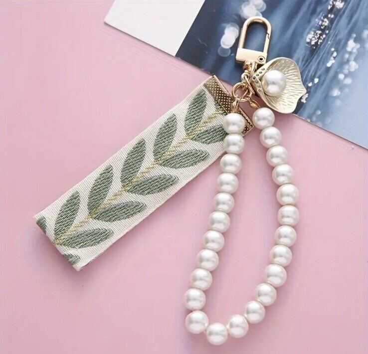 Porte-clés motif feuille/bandeau perlé
